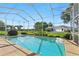 Enjoy this screened pool with an outside view, perfect for relaxing on sunny days at 4428 Gevalia Dr, Brooksville, FL 34604