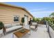 Comfortable outdoor seating area on a back deck with a grill and dining table at 4915 Stolls Ave, Tampa, FL 33615