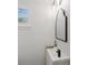 Modern half bathroom featuring vanity with new sink, mirror, and lighting at 4915 Stolls Ave, Tampa, FL 33615