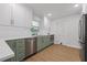 Updated kitchen featuring stainless steel appliances, modern countertops, and ample cabinet space at 4915 Stolls Ave, Tampa, FL 33615