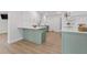 Bright, updated kitchen featuring a center island with barstool seating and modern appliances at 4915 Stolls Ave, Tampa, FL 33615
