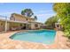 Backyard pool and patio, perfect for outdoor entertaining, with lush landscaping at 4915 Stolls Ave, Tampa, FL 33615