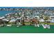 Aerial view of waterfront homes, docks, and boats along a canal neighborhood at 501 Crystal Dr, Madeira Beach, FL 33708