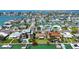 Aerial view showcasing the waterfront property in a picturesque neighborhood with canal access at 501 Crystal Dr, Madeira Beach, FL 33708