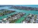 Gorgeous aerial view of waterfront homes with private boat docks on canals, perfect for boating and enjoying coastal living at 501 Crystal Dr, Madeira Beach, FL 33708