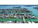 Wide aerial view showcasing waterfront homes and canals, offering a glimpse into the serene coastal living experience at 501 Crystal Dr, Madeira Beach, FL 33708