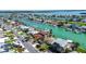 Scenic aerial of waterfront homes along canals, perfect for boating enthusiasts with easy access to open waters at 501 Crystal Dr, Madeira Beach, FL 33708