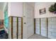 Basement awaiting remodeling with exposed walls, door, and window at 501 Crystal Dr, Madeira Beach, FL 33708