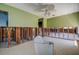 Unfinished bathroom featuring green walls and exposed plumbing for toilet at 501 Crystal Dr, Madeira Beach, FL 33708