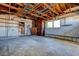 Spacious garage featuring an unfinished ceiling and lots of available storage at 501 Crystal Dr, Madeira Beach, FL 33708