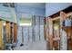 Unfinished kitchen with exposed pipes and window at 501 Crystal Dr, Madeira Beach, FL 33708