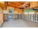 Kitchen area with wooden ceiling and cabinets showing flood damage at 501 Crystal Dr, Madeira Beach, FL 33708