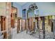 Unfinished living room featuring blue walls and exposed pipes and plumbing at 501 Crystal Dr, Madeira Beach, FL 33708