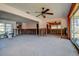 Open living room featuring ceiling fan, natural light, and open design after flood damage at 501 Crystal Dr, Madeira Beach, FL 33708