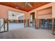 Open-concept living room with tiled floors; flood damage evident in structure at 501 Crystal Dr, Madeira Beach, FL 33708