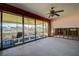 Living room leading to patio with sliding glass doors; flood damage evident at 501 Crystal Dr, Madeira Beach, FL 33708