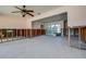 Spacious living room with ceiling fan and large windows after flood damage at 501 Crystal Dr, Madeira Beach, FL 33708