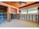 Living room with wood ceiling and large windows; flood damage visible at 501 Crystal Dr, Madeira Beach, FL 33708