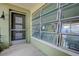 Enclosed porch area with a screen door and awning windows at 501 Crystal Dr, Madeira Beach, FL 33708