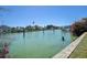 Scenic waterfront view showing calm water, docks, and nearby houses at 501 Crystal Dr, Madeira Beach, FL 33708