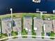 Aerial view of homes, landscaping, and canal access in a residential community at 5307 Wishing Arch Dr, Apollo Beach, FL 33572