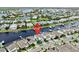 Aerial view of waterfront homes, docks, and boat access in a residential community at 5307 Wishing Arch Dr, Apollo Beach, FL 33572