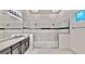 Modern bathroom features a double vanity with sleek gray cabinets and a large walk-in shower at 5307 Wishing Arch Dr, Apollo Beach, FL 33572