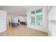 Open concept living room and kitchen area with modern finishes and abundant natural light at 5307 Wishing Arch Dr, Apollo Beach, FL 33572