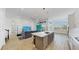 Spacious open-concept living space featuring a modern kitchen and comfortable seating area at 5307 Wishing Arch Dr, Apollo Beach, FL 33572