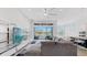 Bright, open living room showcasing a modern kitchen, comfortable seating, and lots of natural light at 5307 Wishing Arch Dr, Apollo Beach, FL 33572