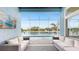 Screened-in lanai featuring comfortable seating and a view of the water at 5307 Wishing Arch Dr, Apollo Beach, FL 33572