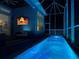 Enclosed patio with a pool, tv, and comfortable seating at 5307 Wishing Arch Dr, Apollo Beach, FL 33572