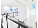 Bright foyer with a modern staircase, black metal railing, and natural light at 5307 Wishing Arch Dr, Apollo Beach, FL 33572