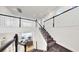 View of home's staircase with white railing that leads to the living room and other areas of the home at 5307 Wishing Arch Dr, Apollo Beach, FL 33572