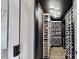 Well-lit wine cellar with custom storage, offering a perfect space for wine enthusiasts at 5307 Wishing Arch Dr, Apollo Beach, FL 33572