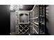 Custom wine cellar with elegant lighting and ample storage for wine bottles and accessories at 5307 Wishing Arch Dr, Apollo Beach, FL 33572
