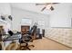 Bedroom featuring a desk, chair, and ceiling fan at 5422 Braddock Dr, Zephyrhills, FL 33541