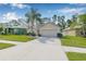 Charming single-story home with a well-maintained lawn, mature trees, and two car garage at 5422 Braddock Dr, Zephyrhills, FL 33541