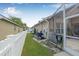 Exterior view of a single Gathering home with a green backyard and white picket fence at 5422 Braddock Dr, Zephyrhills, FL 33541