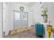 Inviting foyer with decorative tile flooring, a stylish entry door, and charming interior design elements at 5422 Braddock Dr, Zephyrhills, FL 33541