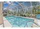 Inviting screened pool with a relaxing spa area, perfect for outdoor entertaining and enjoyment at 5422 Braddock Dr, Zephyrhills, FL 33541