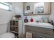 Modern bathroom with a sink, toilet, vanity, and storage baskets at 5741 91St N Ave, Pinellas Park, FL 33782