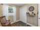 Cozy bedroom with a rocking chair, a window, and hardwood floors at 5741 91St N Ave, Pinellas Park, FL 33782