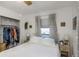 Bedroom featuring a window, closet with storage, and side tables with lamps at 5741 91St N Ave, Pinellas Park, FL 33782