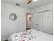 Bright bedroom with a mirror on the wall and a view into an adjacent room at 5741 91St N Ave, Pinellas Park, FL 33782