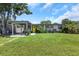Charming single story home with a well-maintained lawn, carport, and a bright yellow front door at 5741 91St N Ave, Pinellas Park, FL 33782