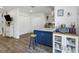 Bright kitchen with a blue island, modern appliances, and ample storage at 5741 91St N Ave, Pinellas Park, FL 33782