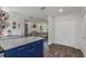 Open concept kitchen with tile floors looking into the living area and closet at 5741 91St N Ave, Pinellas Park, FL 33782