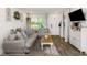 Cozy living room with hardwood floors, neutral furniture, and decor that creates a welcoming atmosphere at 5741 91St N Ave, Pinellas Park, FL 33782