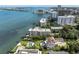 Stunning aerial view of waterfront property with pool and lush landscaping, close to the bay and city at 602 Lime Ave # 102, Clearwater, FL 33756